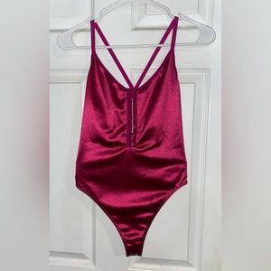 Barbie pink/fuchsia satin bodysuit.